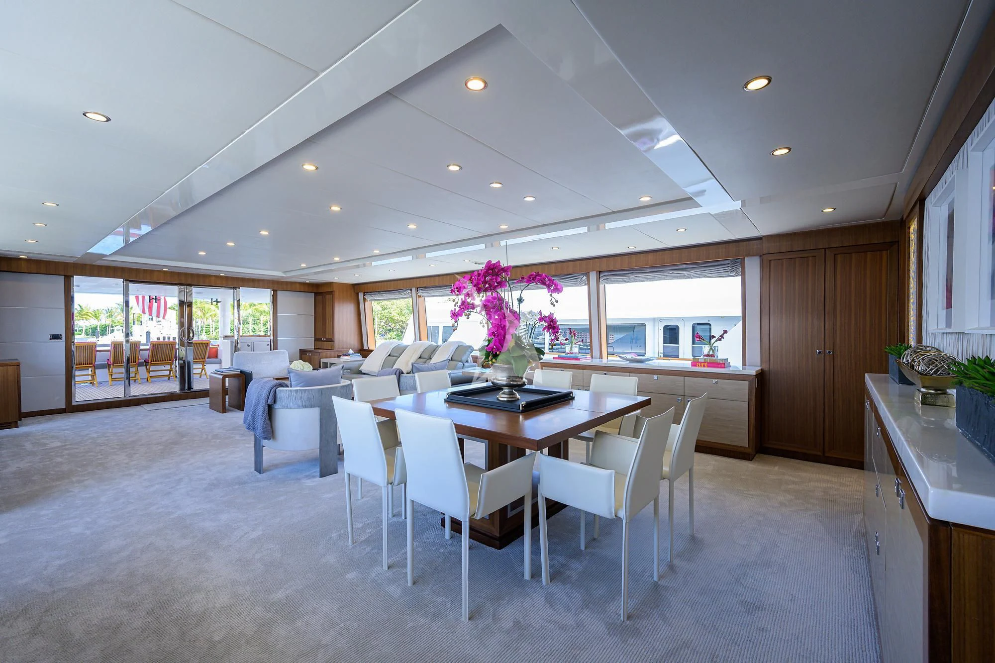 a large kitchen with a table and chairs aboard RISK TAKER Yacht for Charter