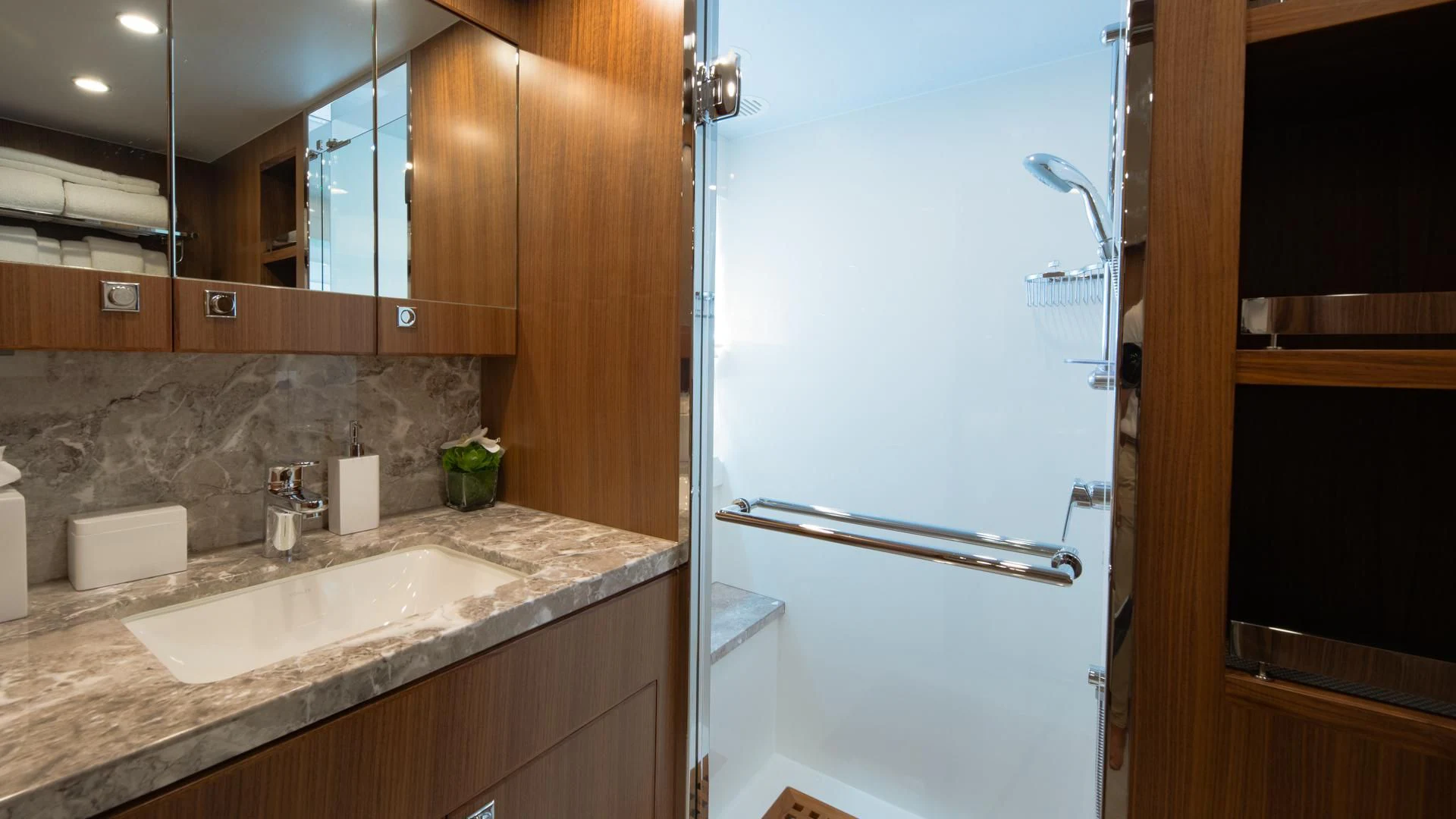 a kitchen with a large refrigerator aboard RISK TAKER Yacht for Charter