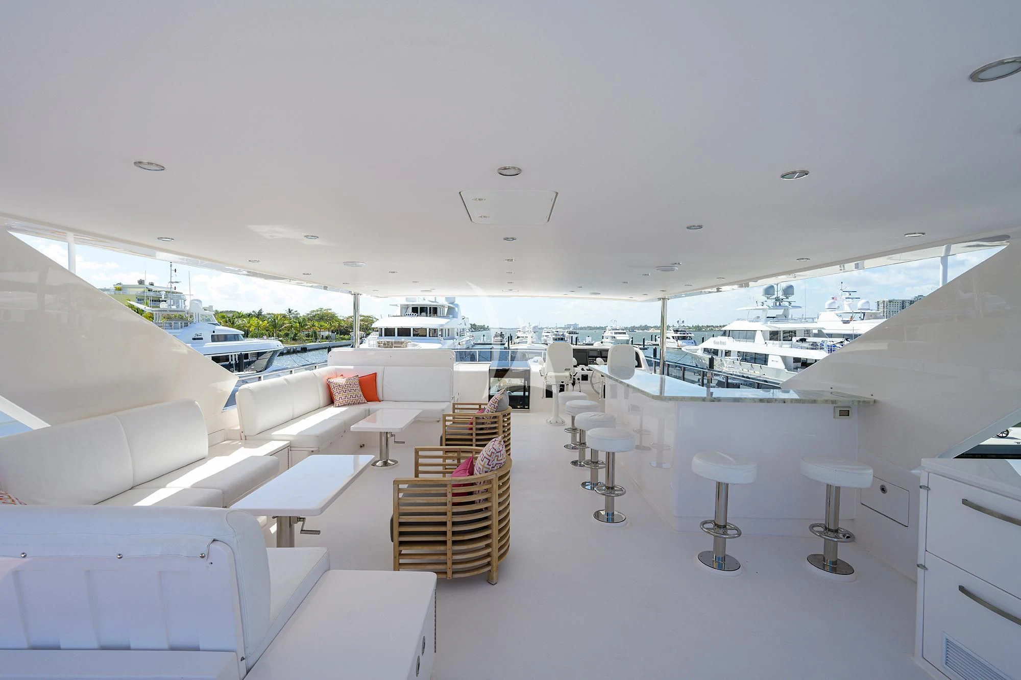 a room with a view of the ocean and the deck aboard RISK TAKER Yacht for Charter