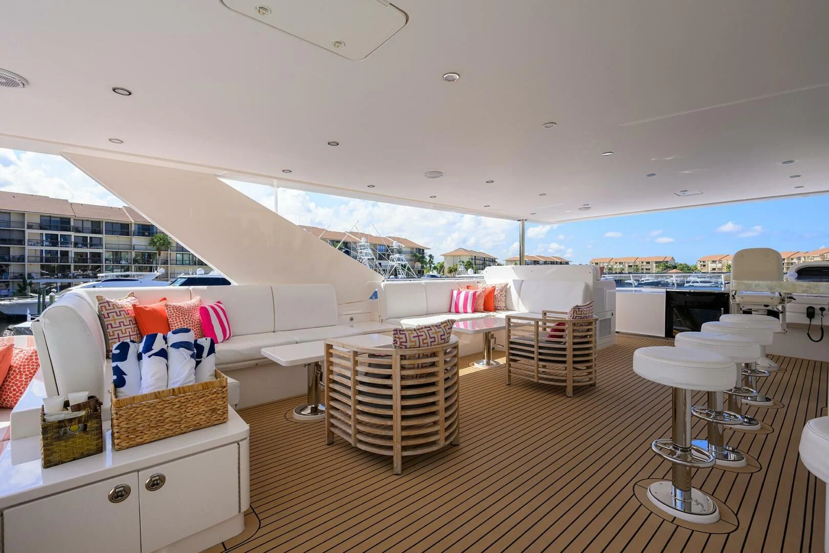 a room with a bed and chairs aboard RISK TAKER Yacht for Charter