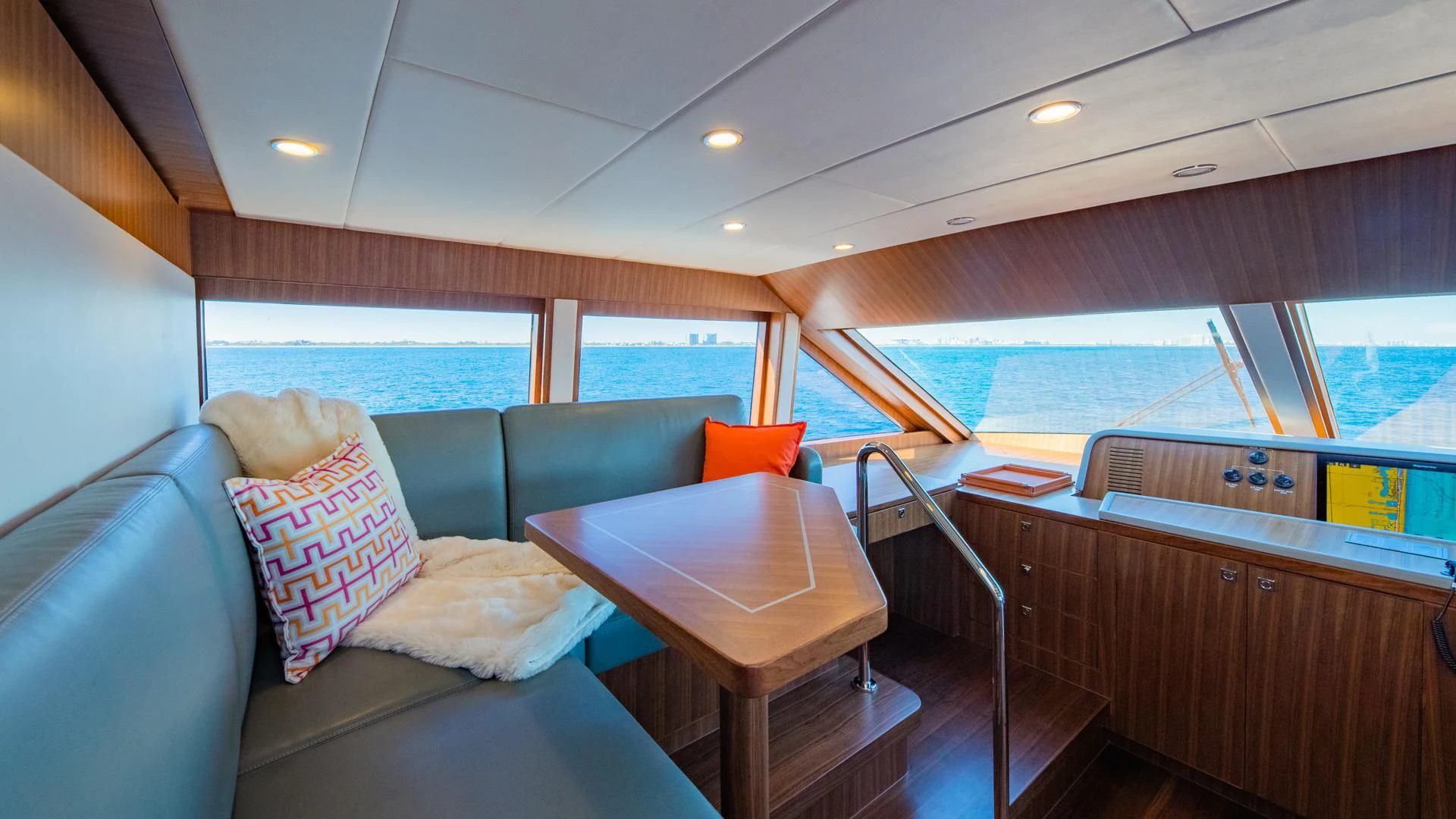 a boat with a table and chairs aboard RISK TAKER Yacht for Charter