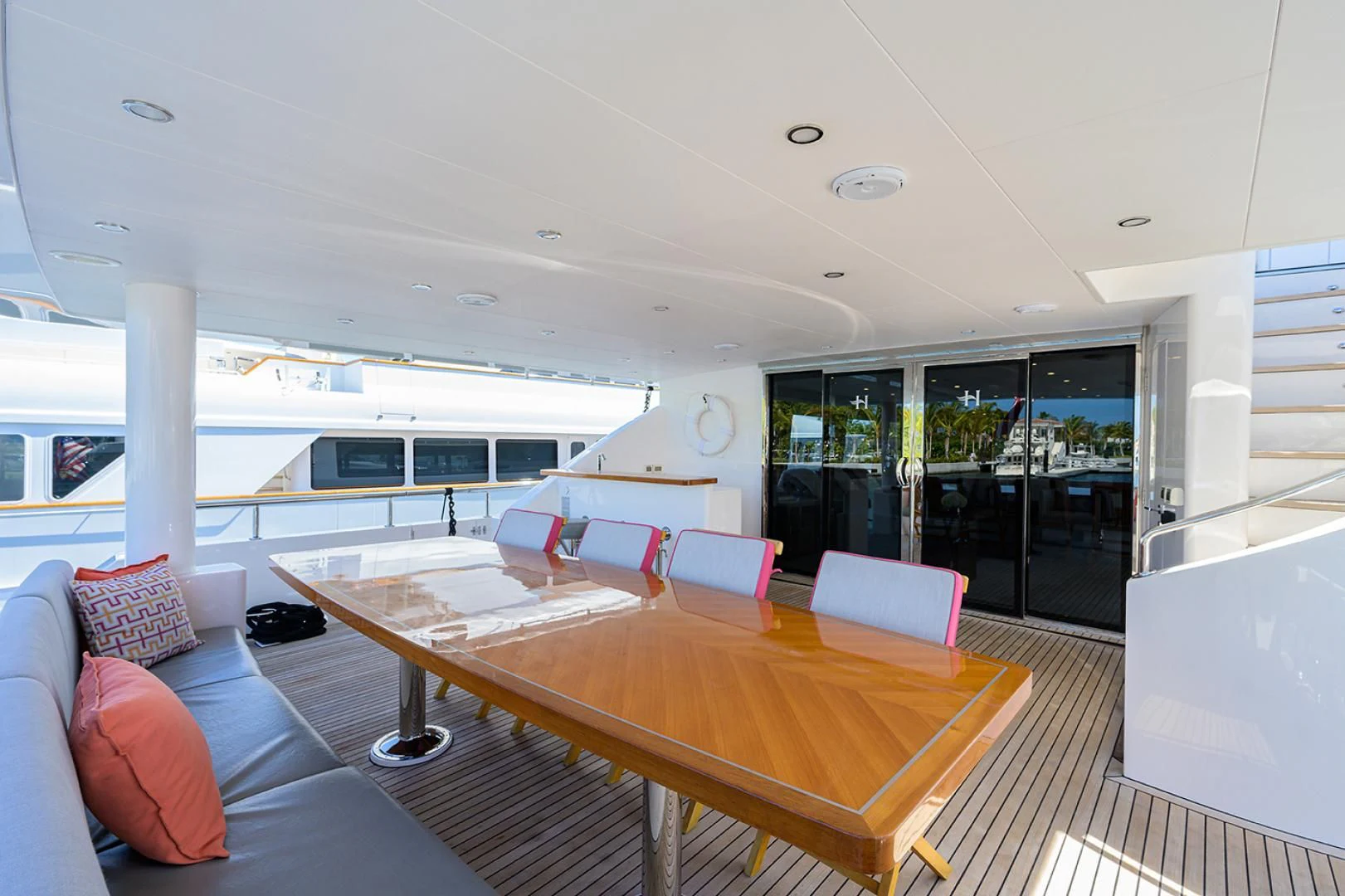 a living room with a large table and couches aboard RISK TAKER Yacht for Charter