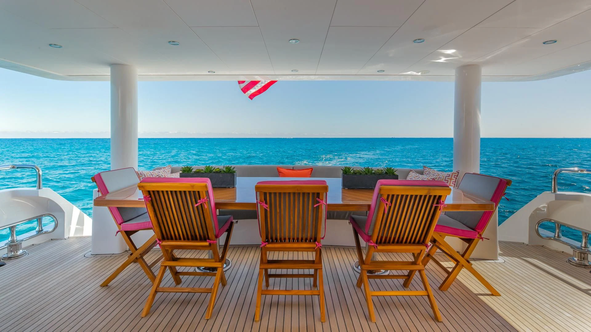 a group of chairs on a deck overlooking a body of water aboard RISK TAKER Yacht for Charter