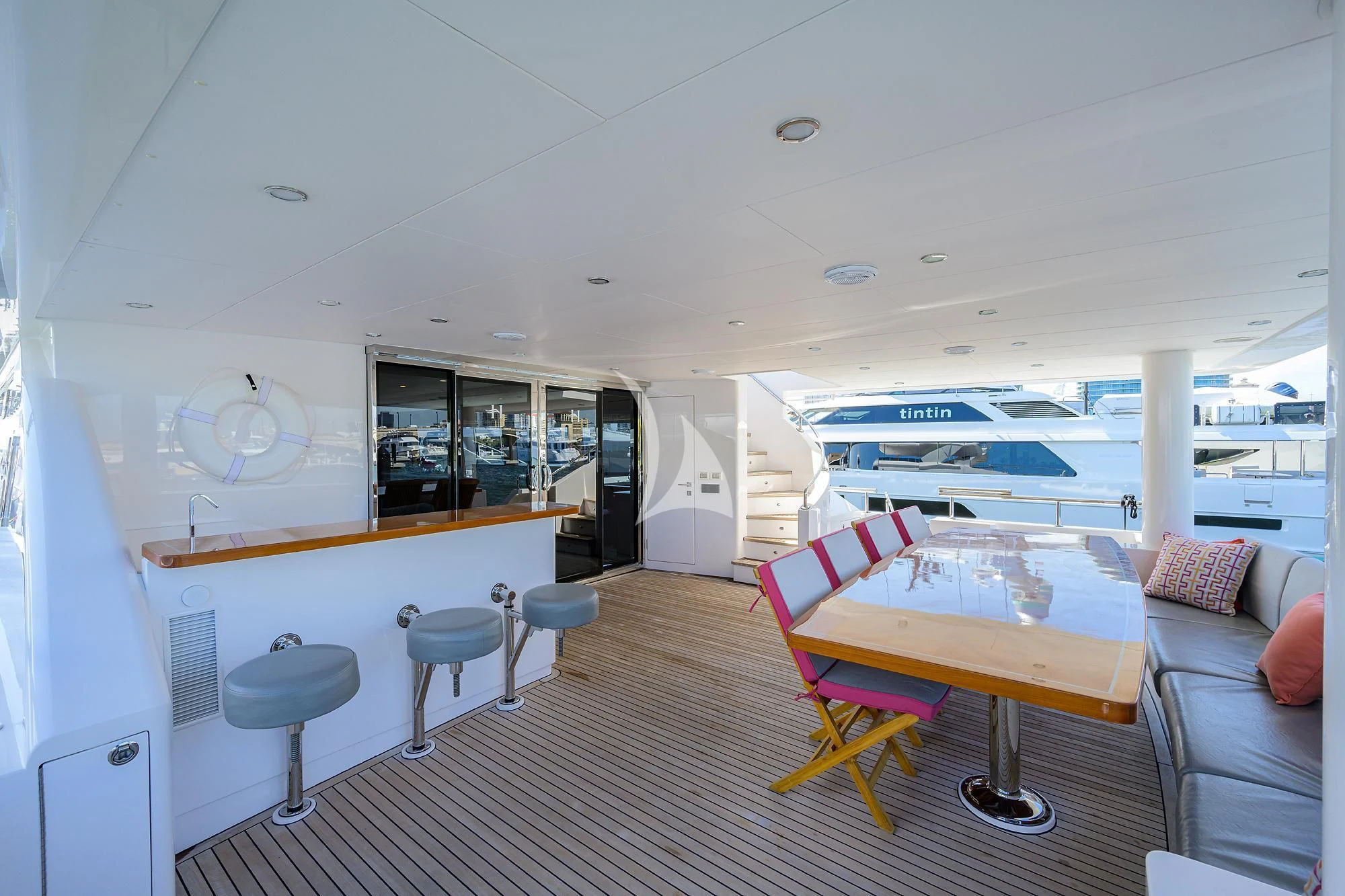 a room with a table and chairs aboard RISK TAKER Yacht for Charter