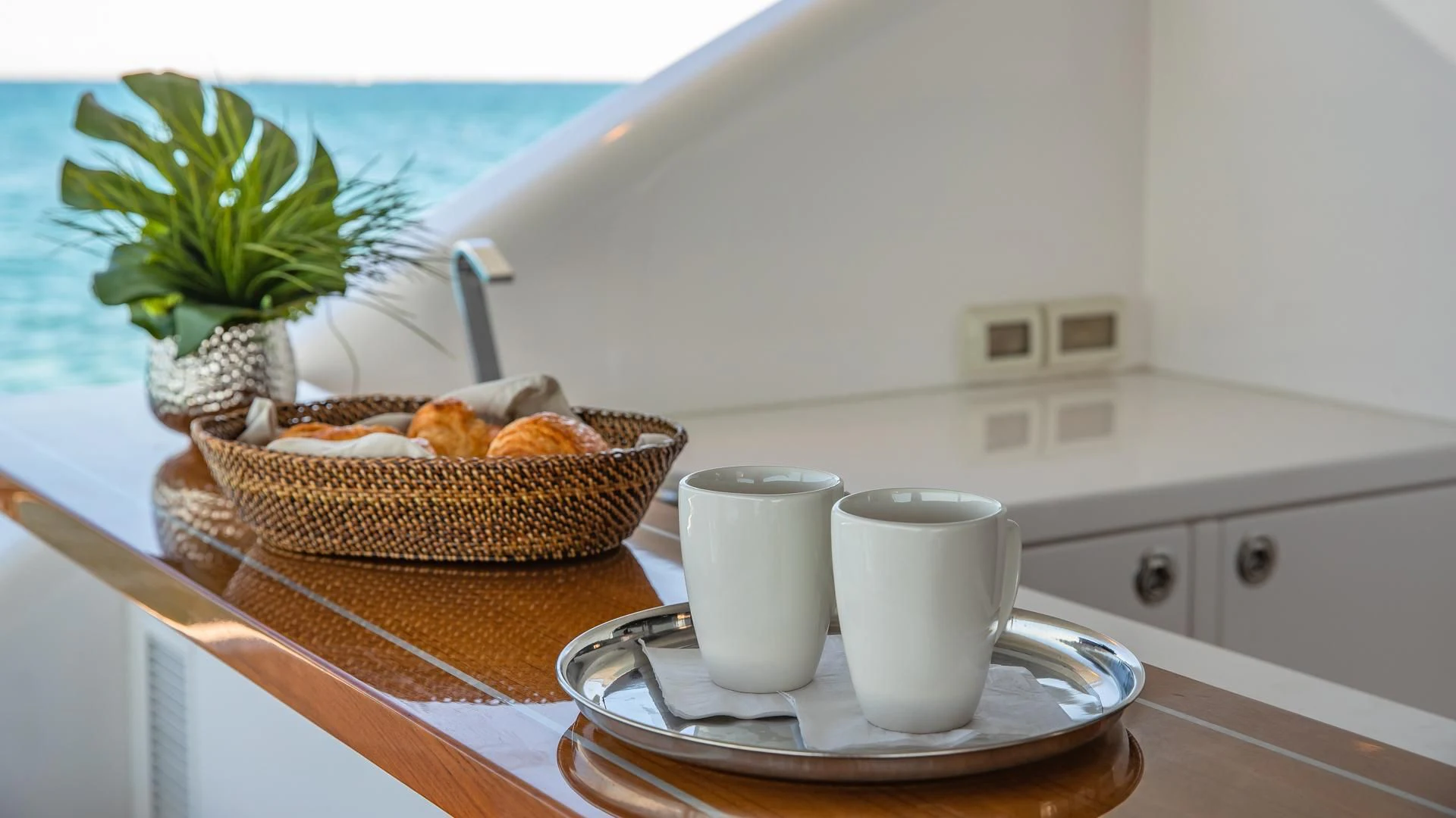 a basket of bread on a counter aboard RISK TAKER Yacht for Charter
