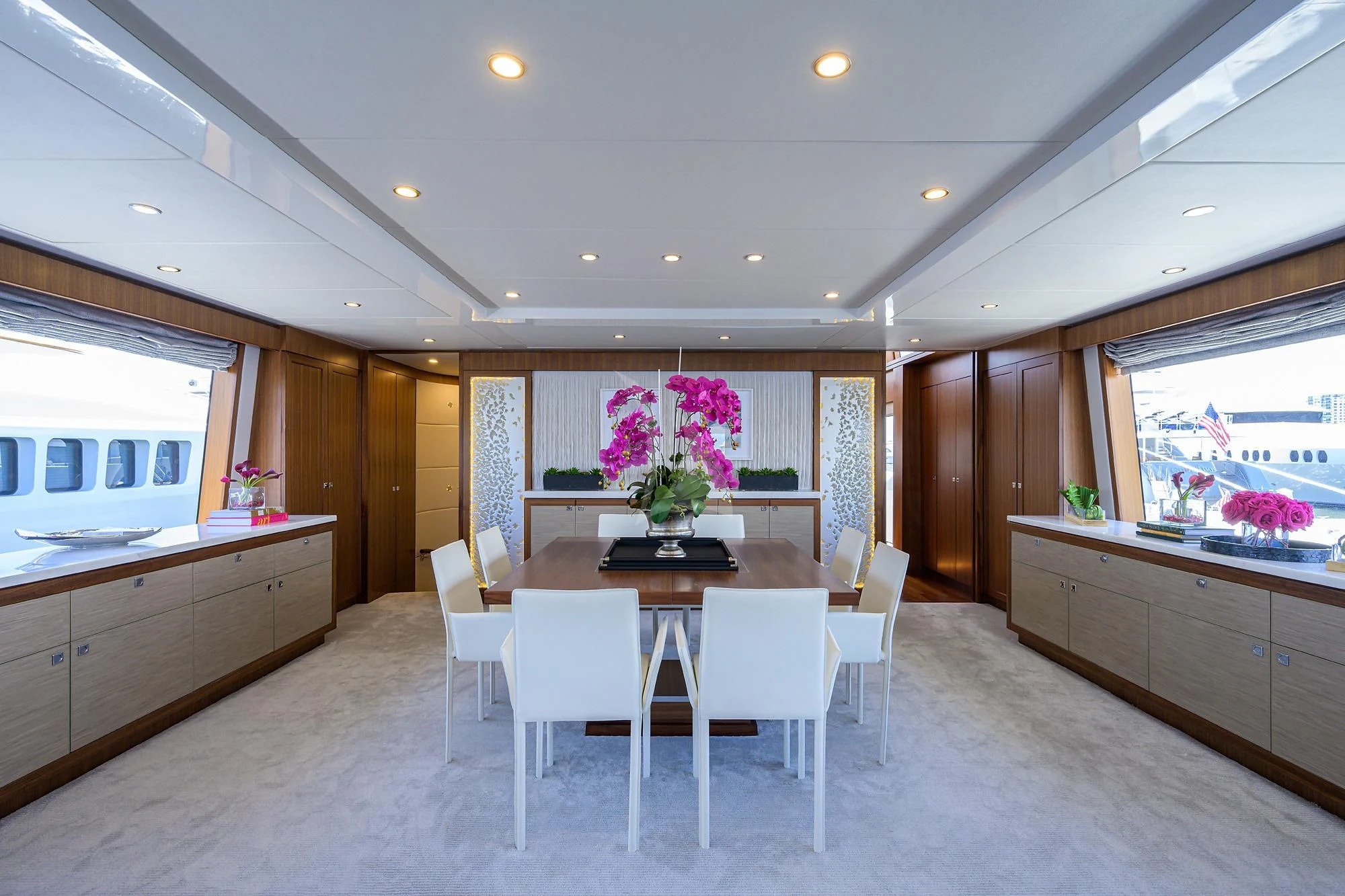 a kitchen with a table and chairs aboard RISK TAKER Yacht for Charter
