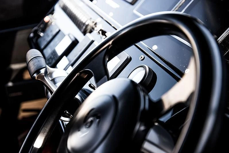 a close-up of a steering wheel aboard CARA MONTANA Yacht for Sale