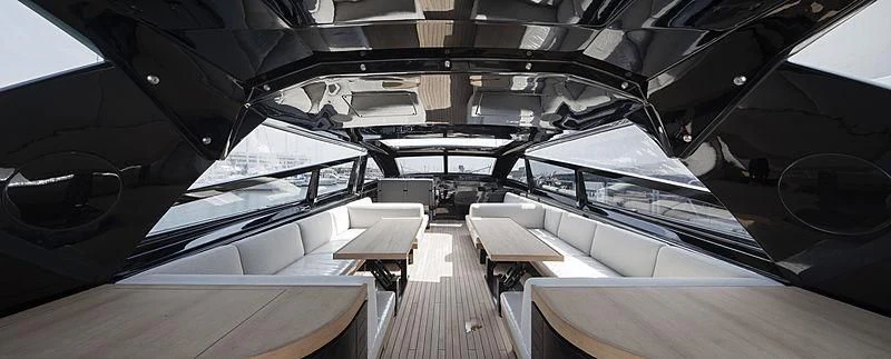 a room with a large group of chairs and a table aboard CARA MONTANA Yacht for Sale