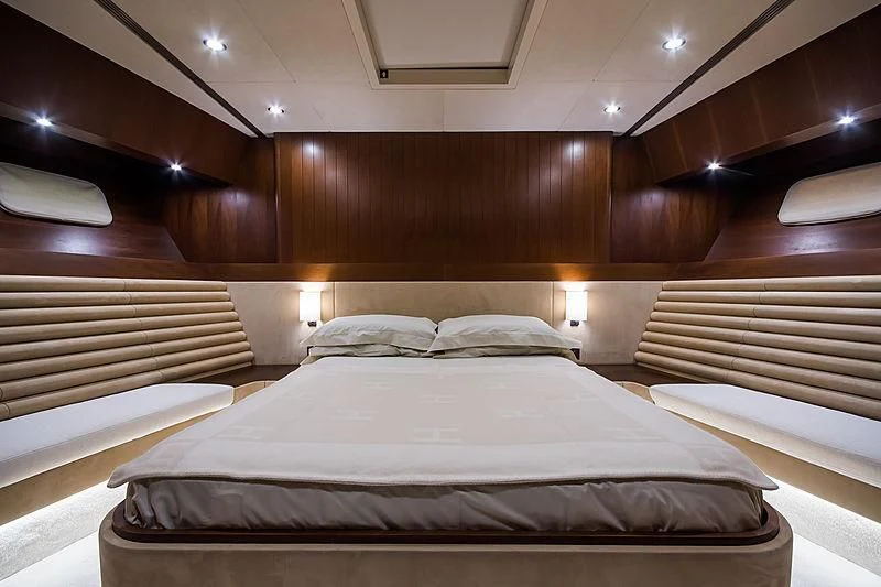a room with a bed and a wood wall aboard CARA MONTANA Yacht for Sale