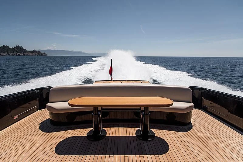 a table on a deck overlooking the ocean aboard CARA MONTANA Yacht for Sale