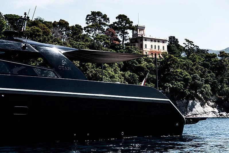 a black boat in the water aboard CARA MONTANA Yacht for Sale