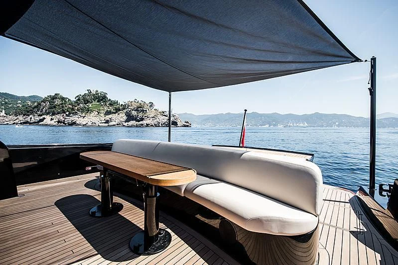 a table on a deck aboard CARA MONTANA Yacht for Sale