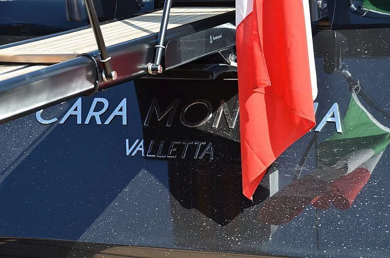 a boat with a flag on it aboard CARA MONTANA Yacht for Sale