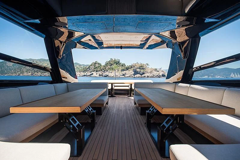 a room with tables and chairs aboard CARA MONTANA Yacht for Sale
