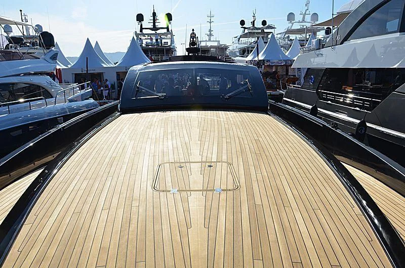 a car on a wooden deck aboard CARA MONTANA Yacht for Sale