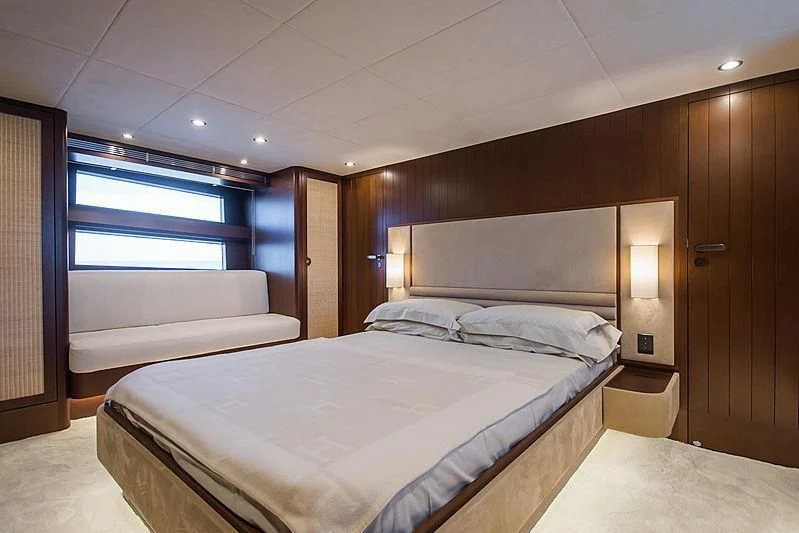 a room with a bed and a window aboard CARA MONTANA Yacht for Sale