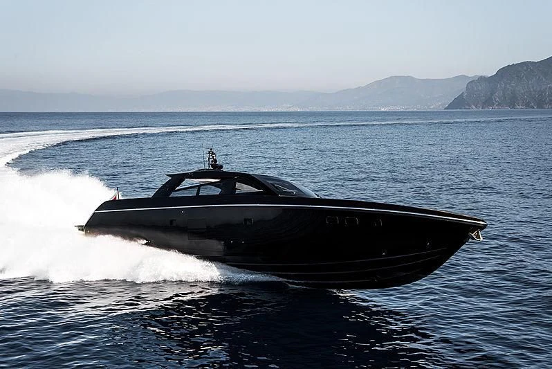 a black boat on water aboard CARA MONTANA Yacht for Sale
