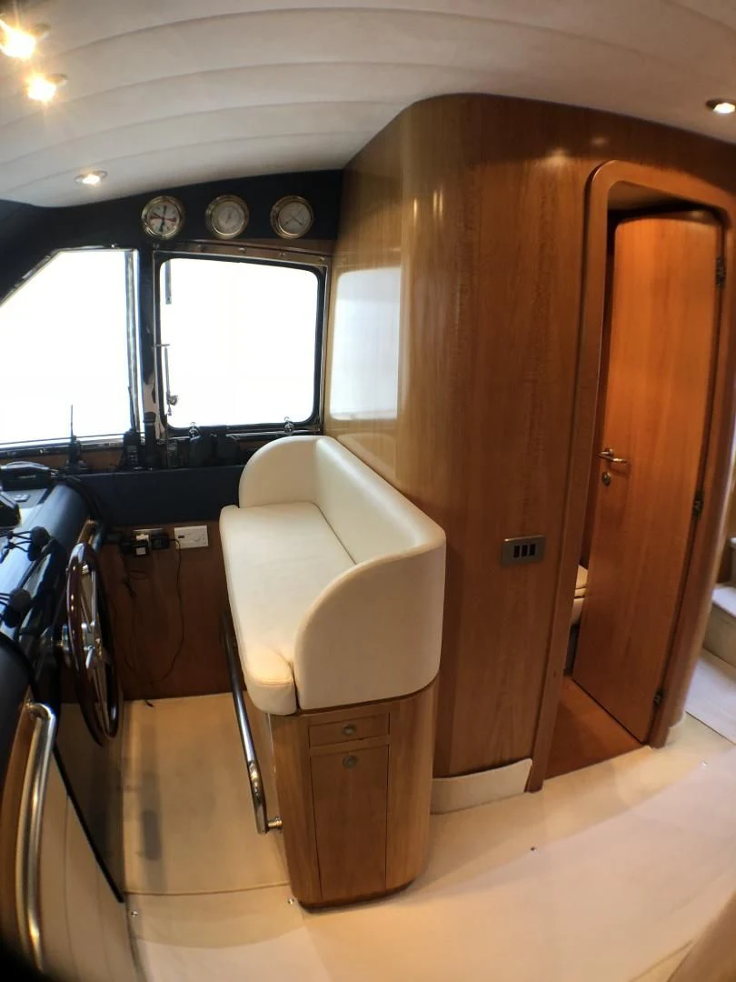 a small bathroom with a toilet aboard LADY J II Yacht for Sale