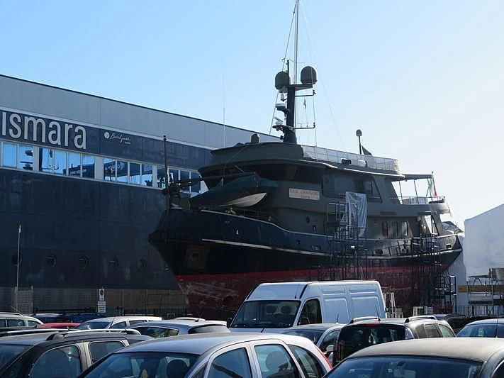 a large ship docked at a pier aboard SAN GENNARO Yacht for Sale