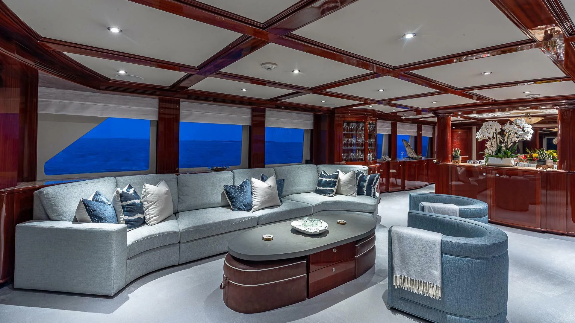 a living room with a large sofa aboard KASHMIR Yacht for Charter