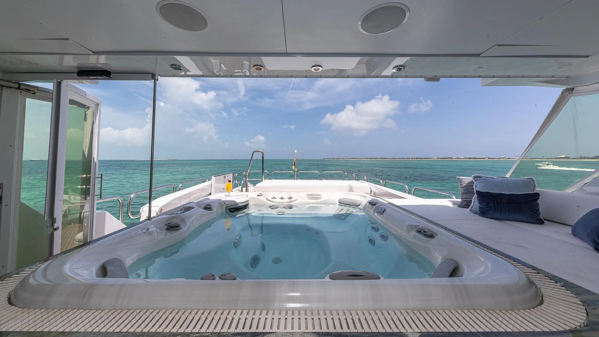a large pool with a deck aboard KASHMIR Yacht for Charter