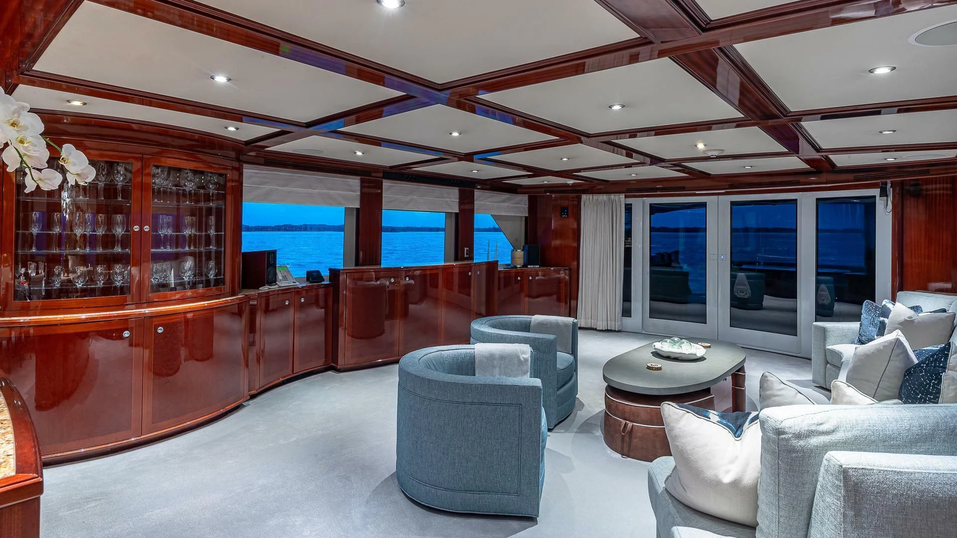 a room with a table chairs and a large window aboard KASHMIR Yacht for Charter