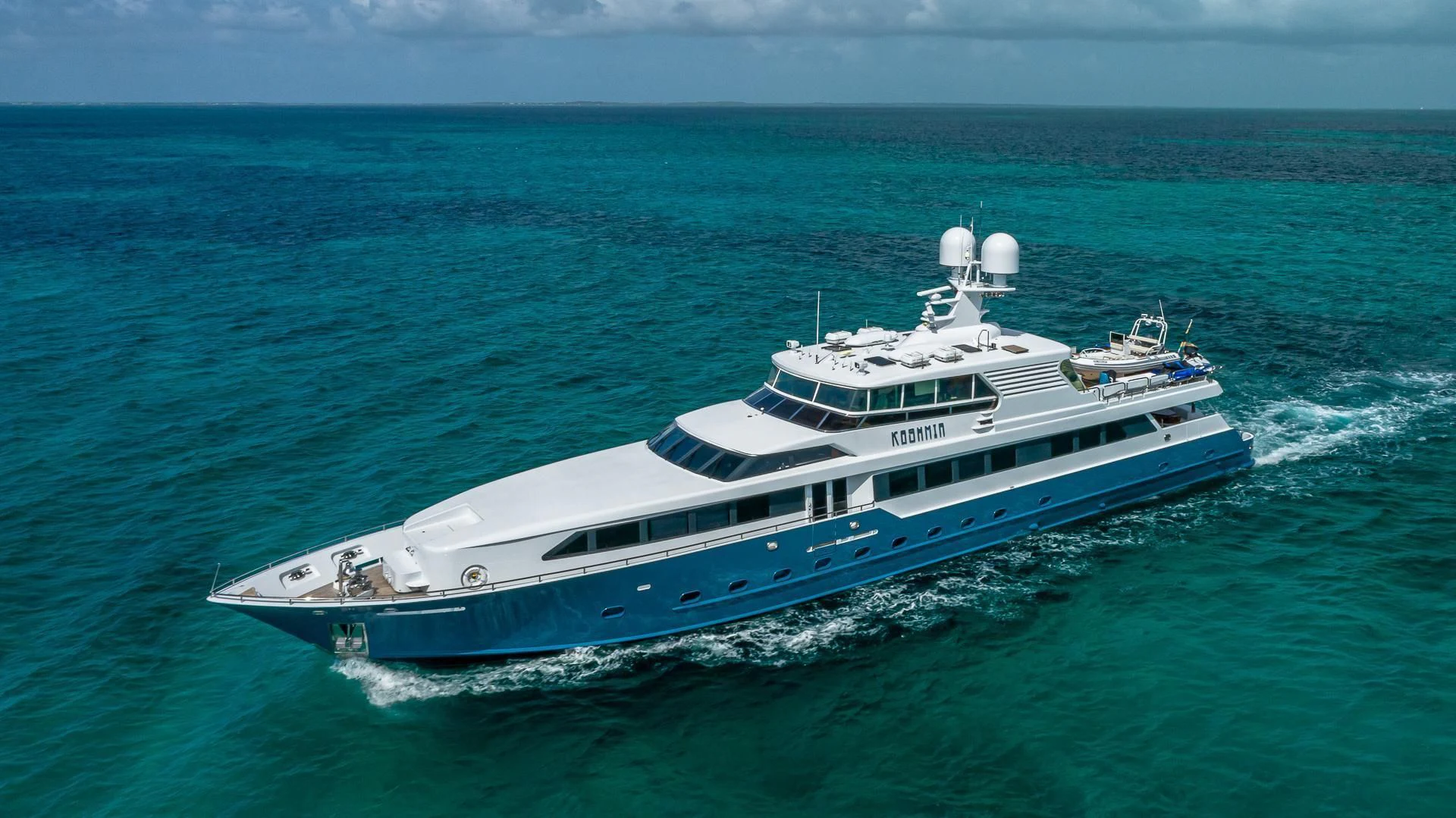 a large white boat in the ocean aboard KASHMIR Yacht for Charter