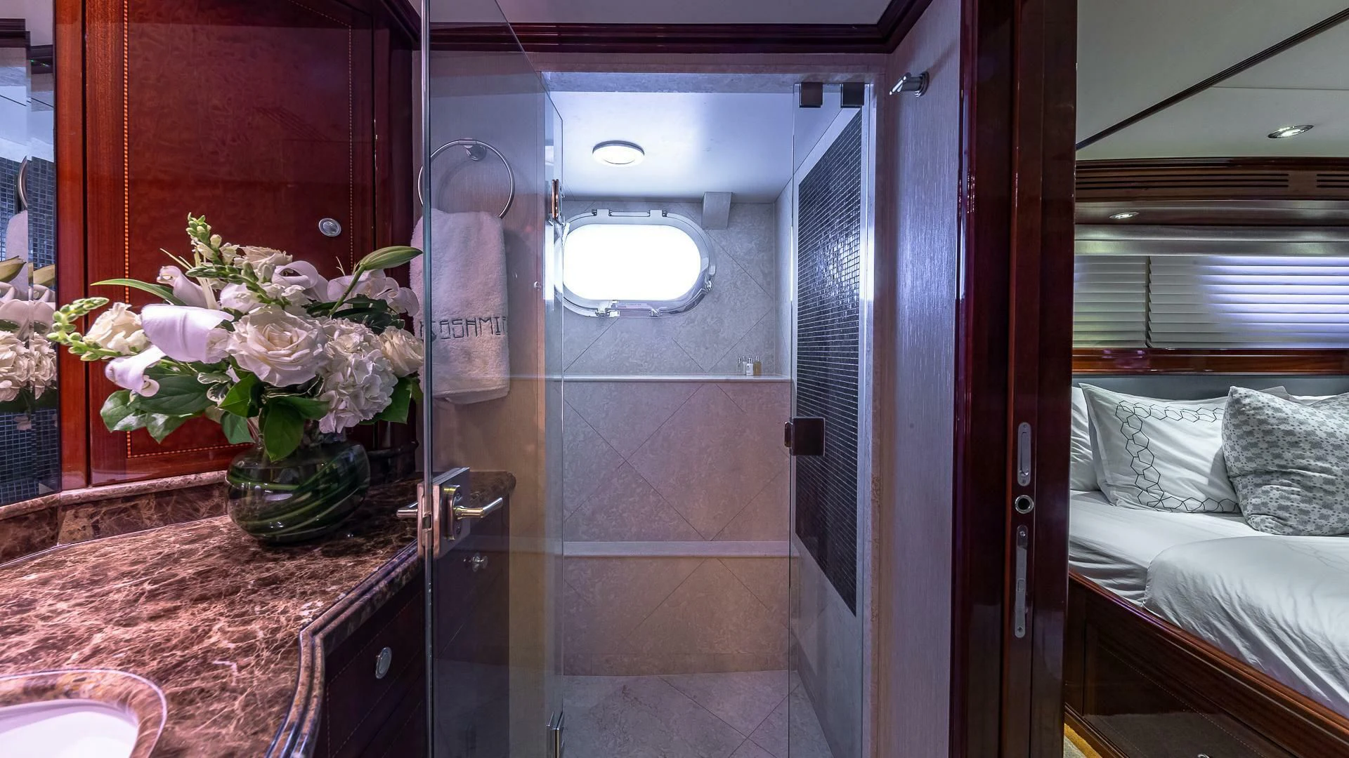 a bathroom with a glass shower aboard KASHMIR Yacht for Charter