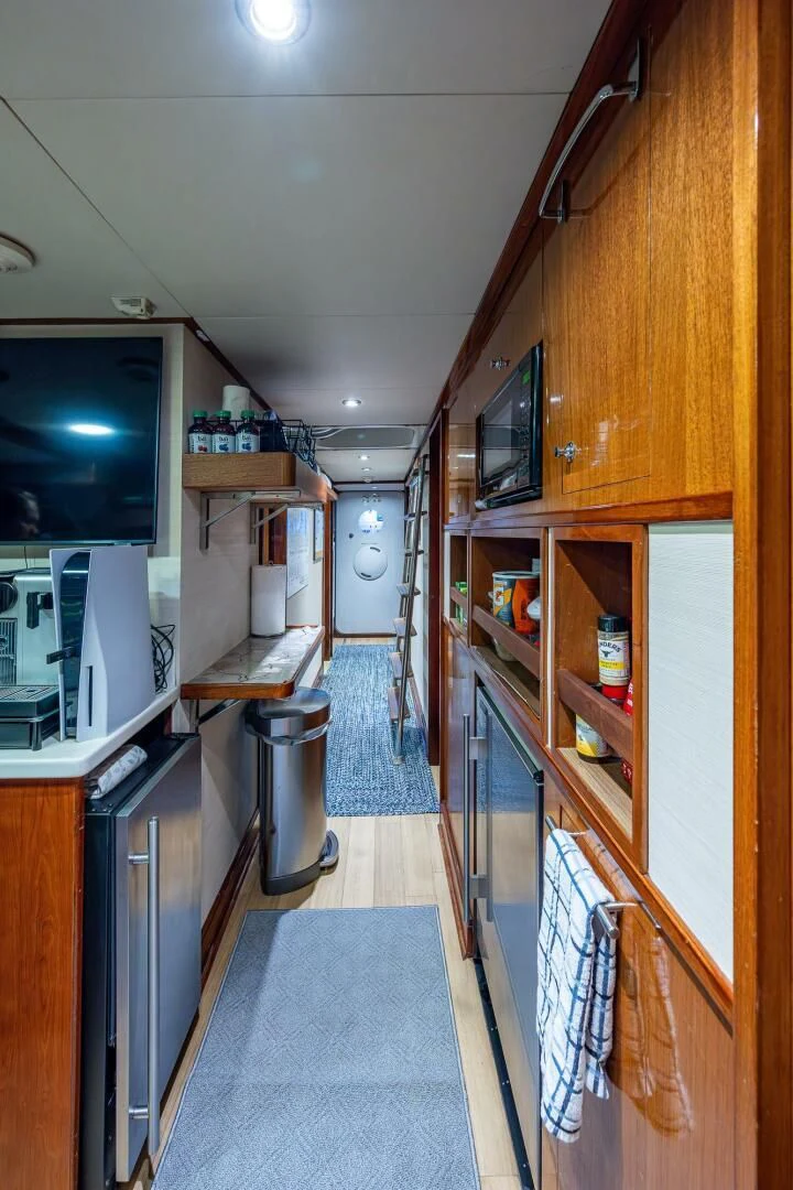 a kitchen with a small island aboard KASHMIR Yacht for Charter