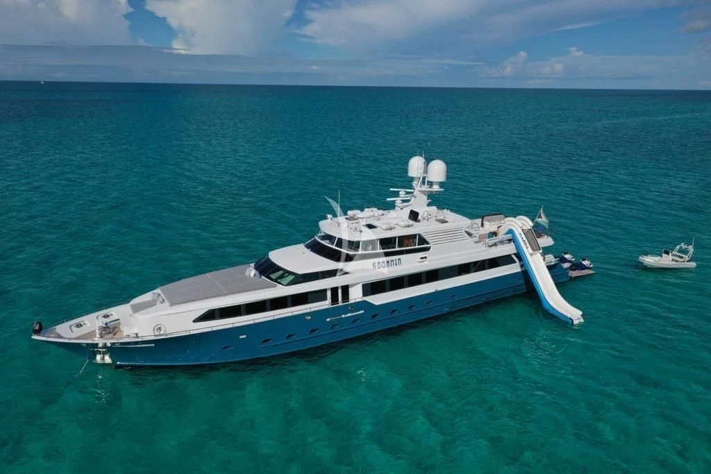 a large white yacht in the ocean aboard KASHMIR Yacht for Charter