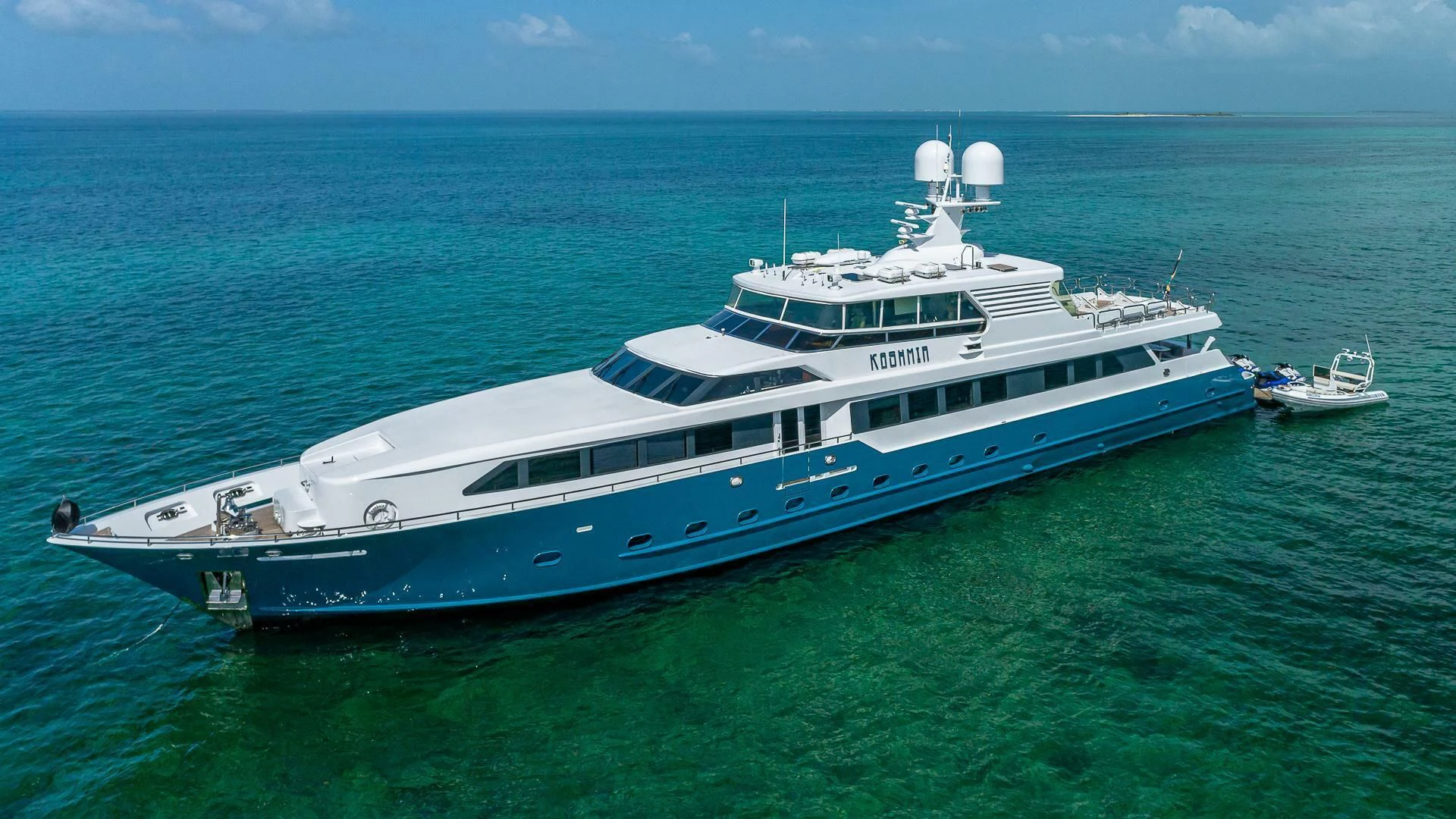 a large white boat in the water aboard KASHMIR Yacht for Charter