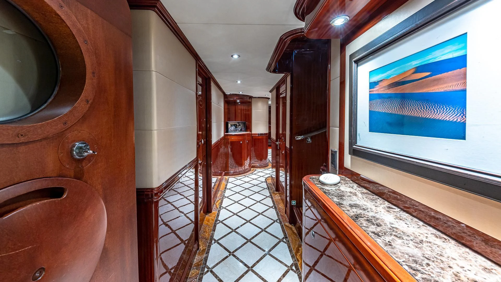a room with a screen and a table and chairs aboard KASHMIR Yacht for Charter