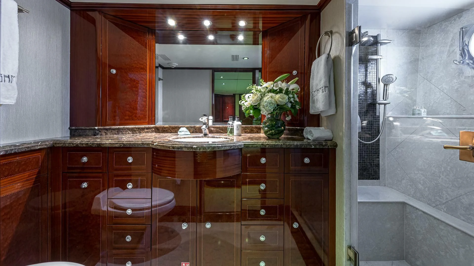 a bathroom with a large mirror aboard KASHMIR Yacht for Charter
