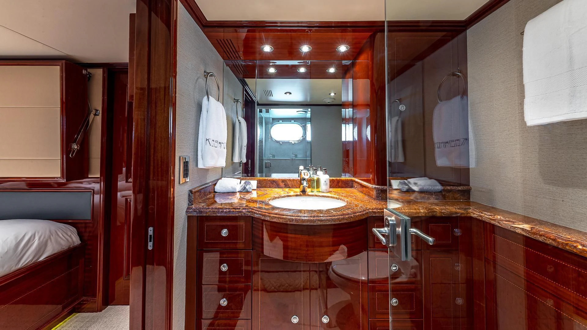 a bathroom with a large mirror aboard KASHMIR Yacht for Charter