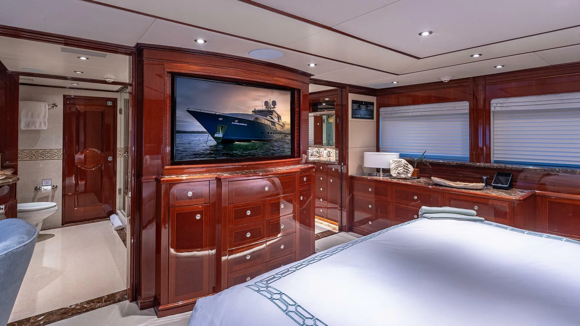 a room with a tv and a bed aboard KASHMIR Yacht for Charter
