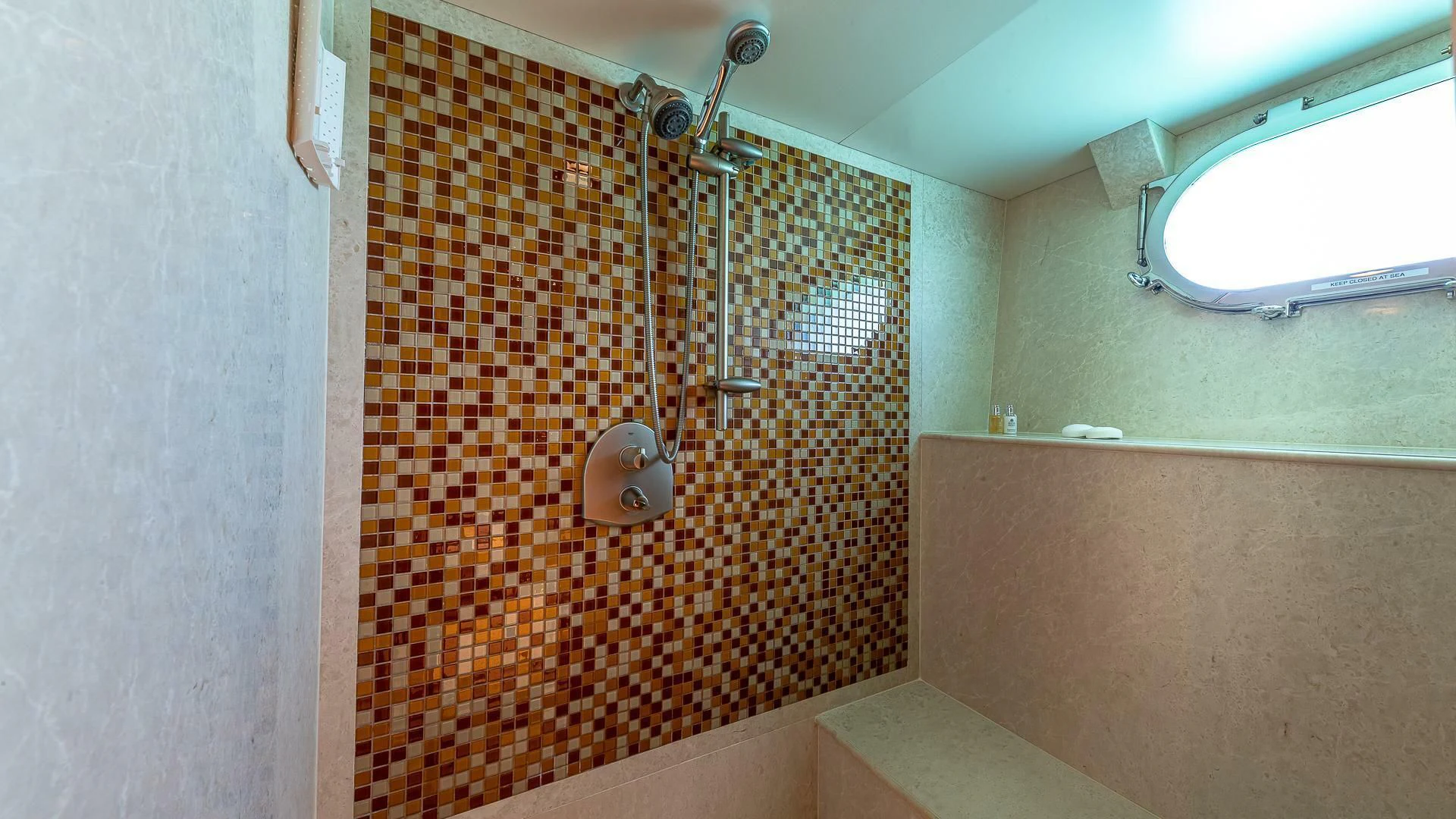 a shower unit in a bathroom aboard KASHMIR Yacht for Charter