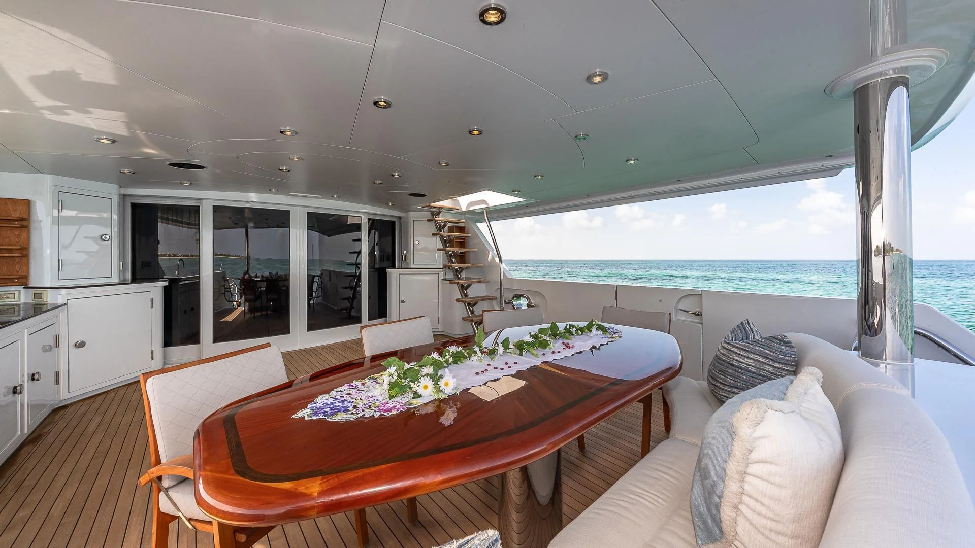 a dining table in a living room aboard KASHMIR Yacht for Charter