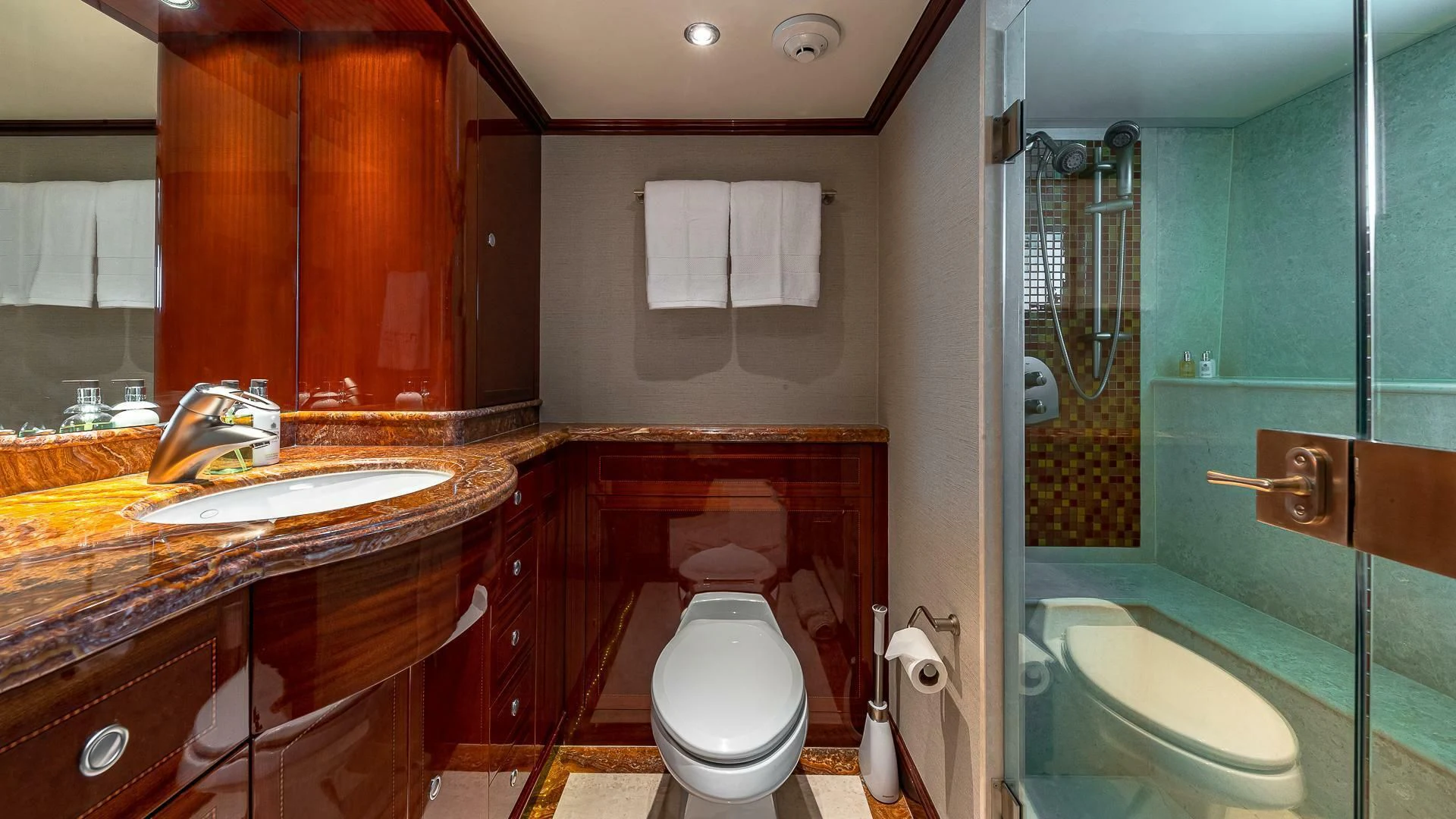 a bathroom with a glass shower aboard KASHMIR Yacht for Charter