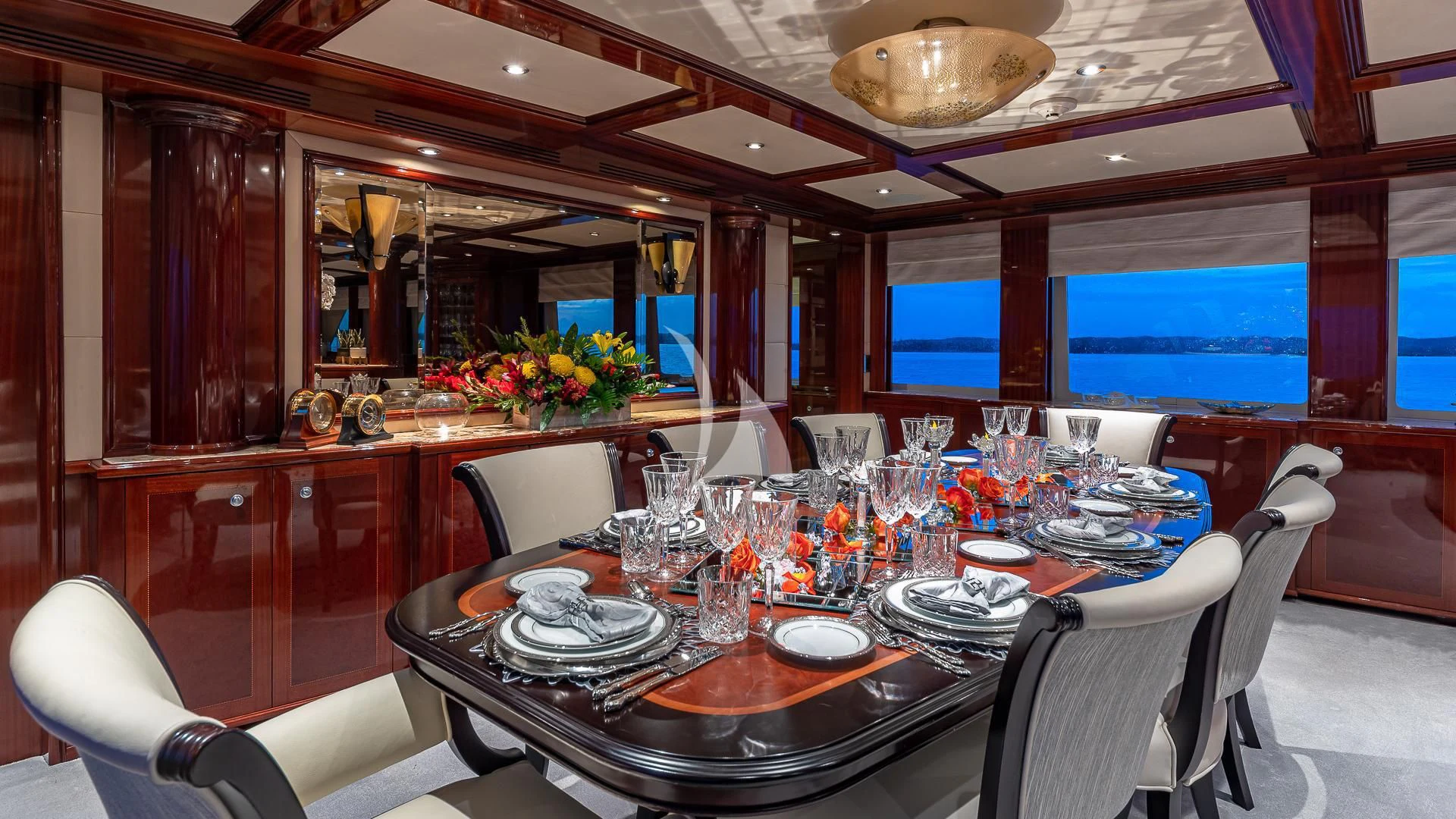 a dining room with a table set aboard KASHMIR Yacht for Charter