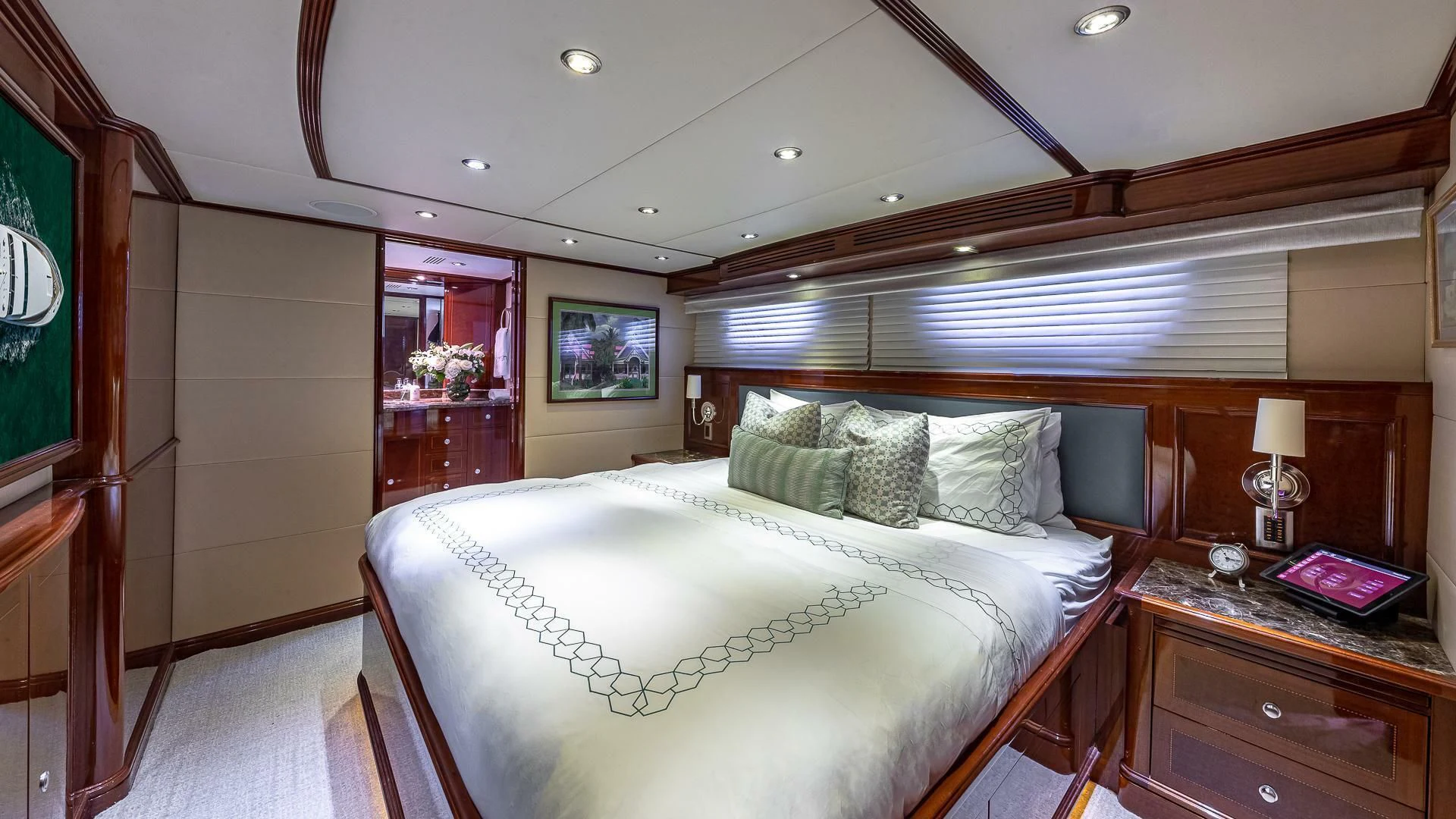 a bedroom with a bed and a window aboard KASHMIR Yacht for Charter
