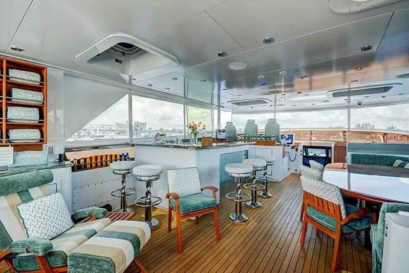 a room with a couch and chairs aboard KASHMIR Yacht for Charter