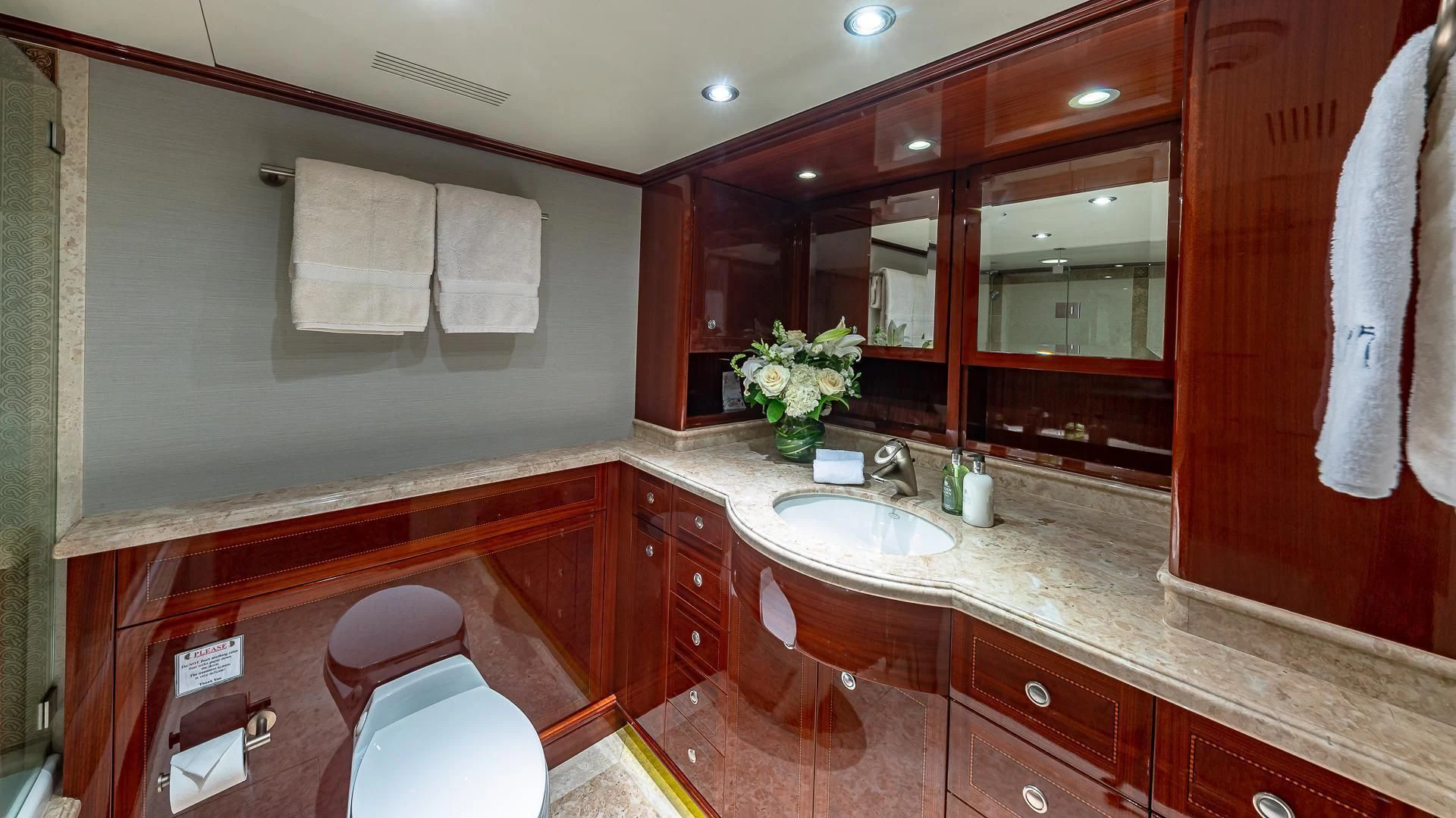 a bathroom with a sink and a mirror aboard KASHMIR Yacht for Charter
