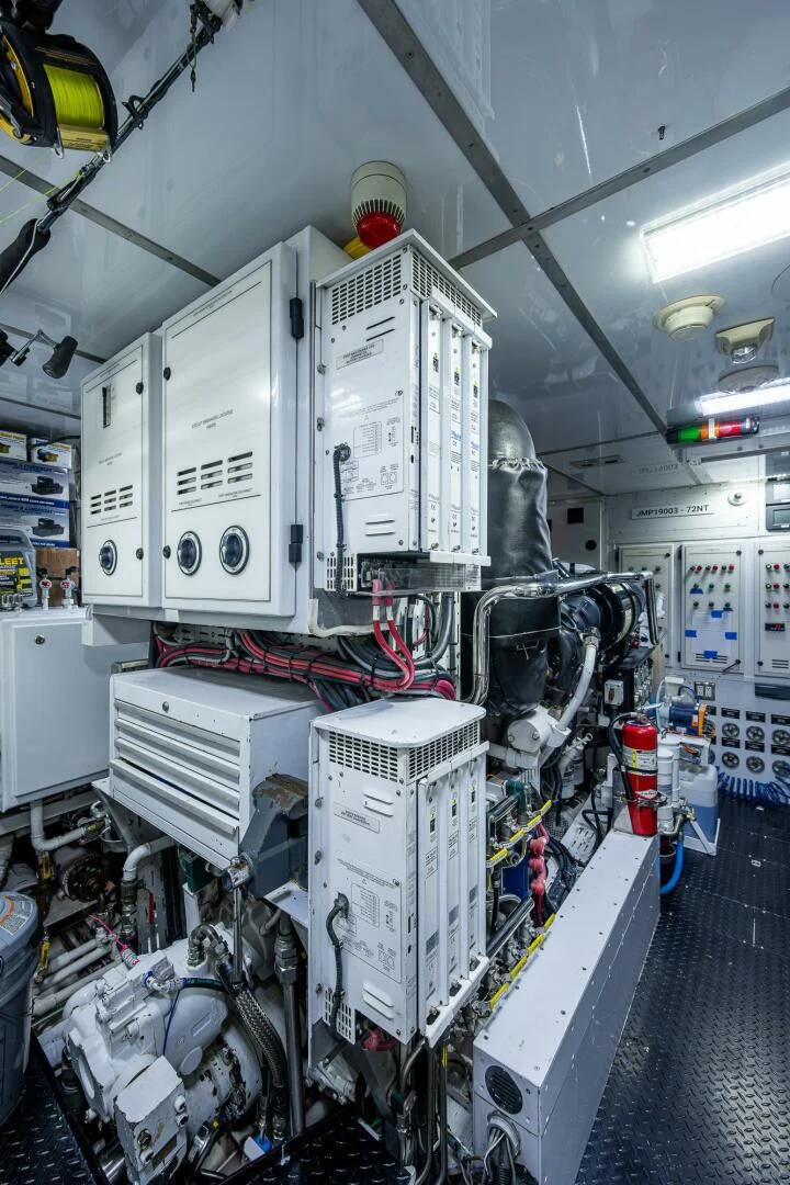 a large white machine in a room aboard KASHMIR Yacht for Charter