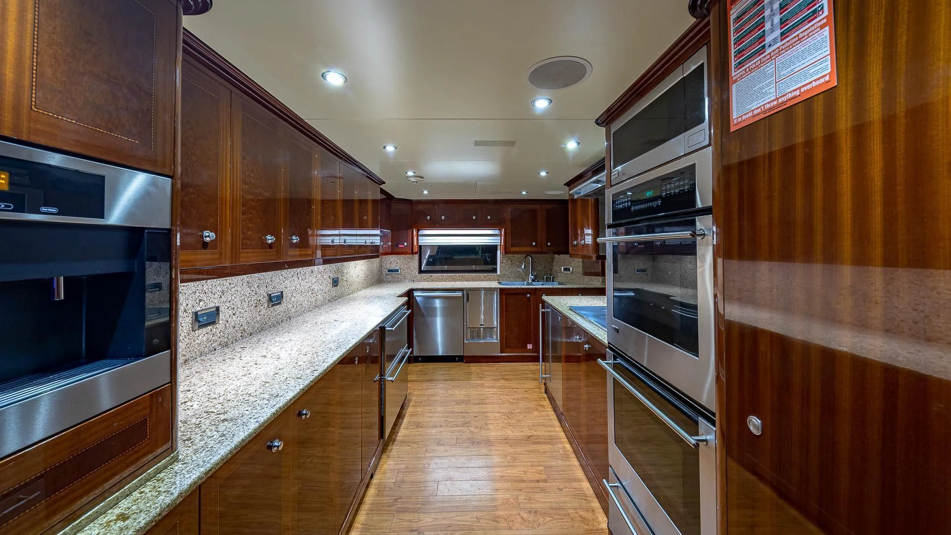a kitchen with wooden cabinets aboard KASHMIR Yacht for Charter