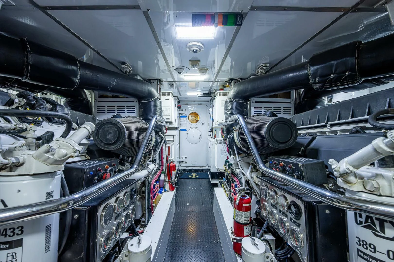 a large room with a large group of pipes and machinery aboard KASHMIR Yacht for Charter