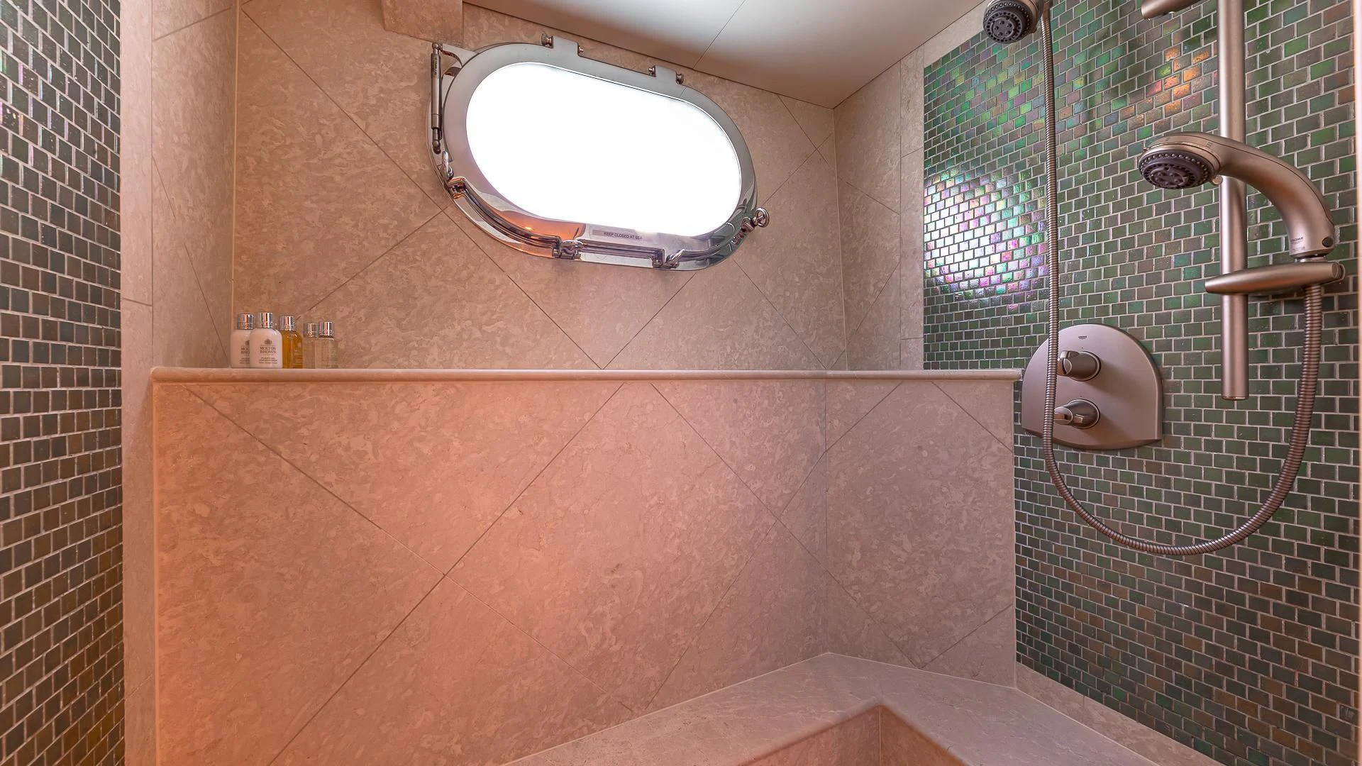 a bathroom with a large mirror aboard KASHMIR Yacht for Charter