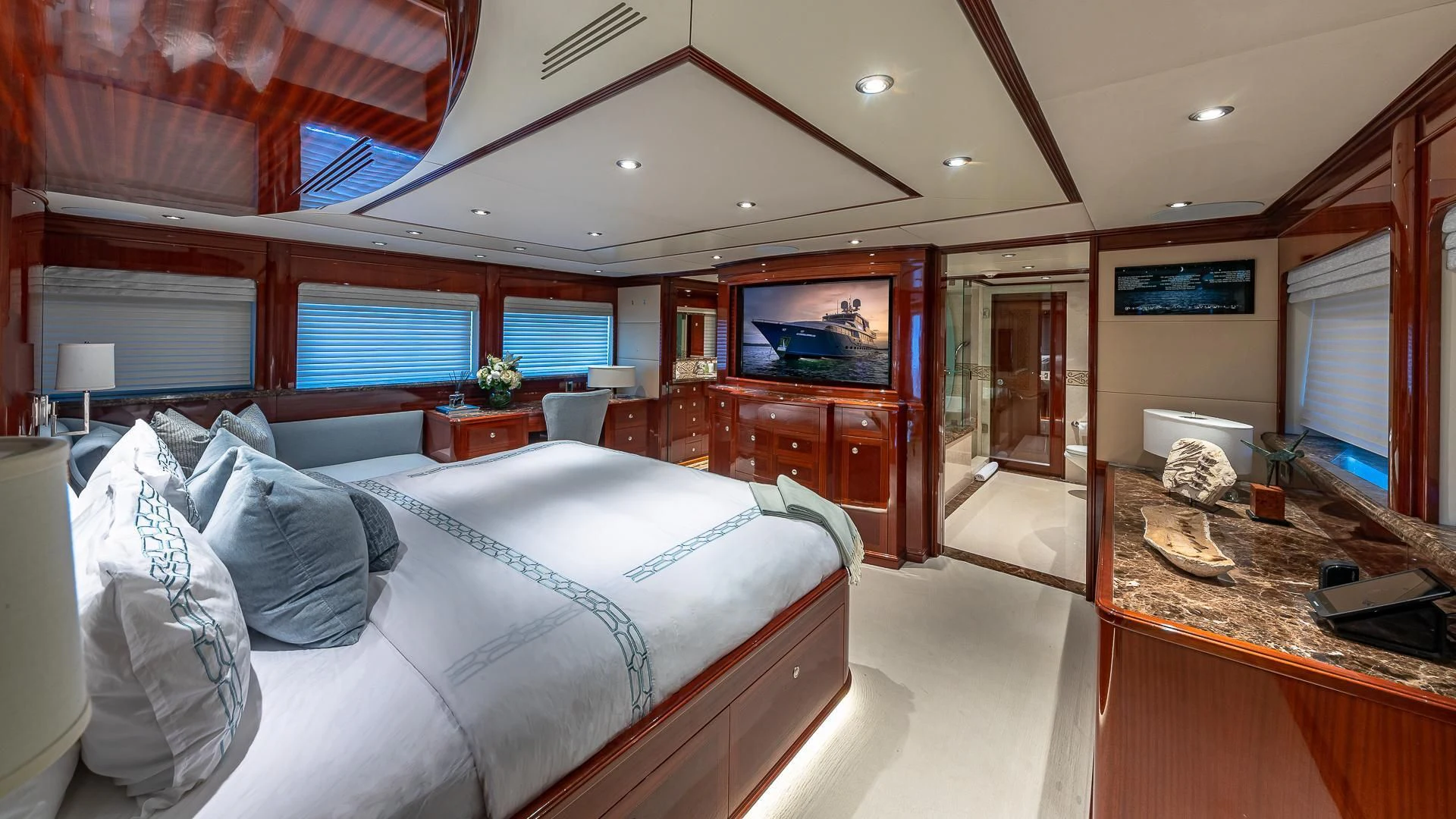 a bedroom with a large bed aboard KASHMIR Yacht for Charter
