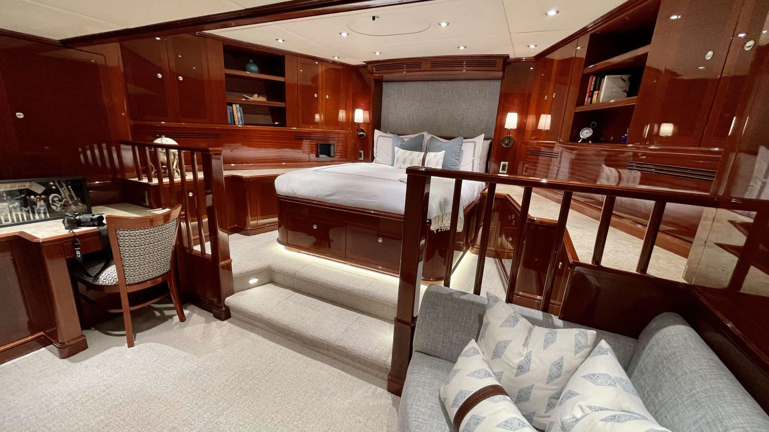 a room with a bed and a desk aboard KASHMIR Yacht for Charter