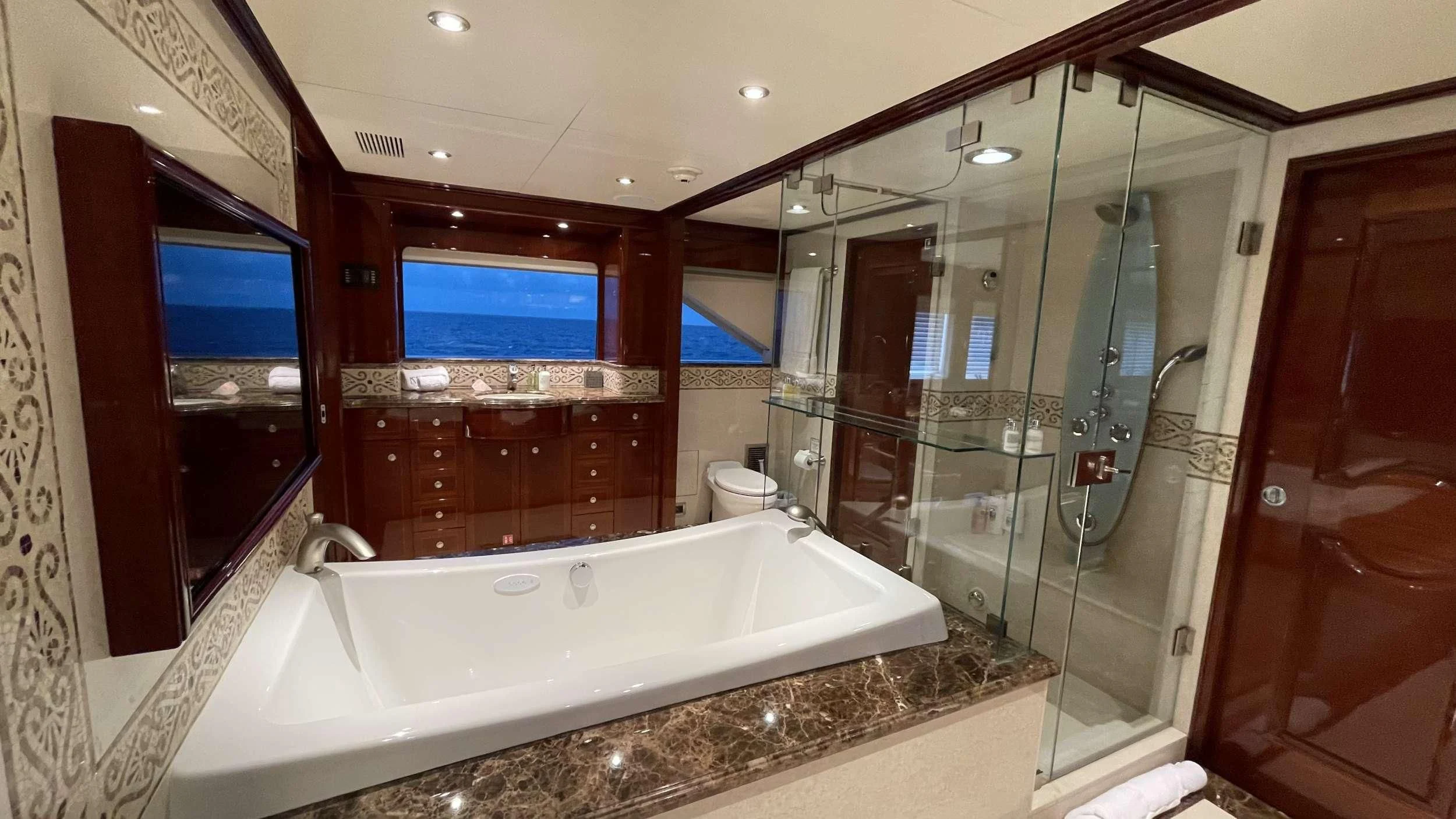 a bathroom with a large bathtub aboard KASHMIR Yacht for Charter