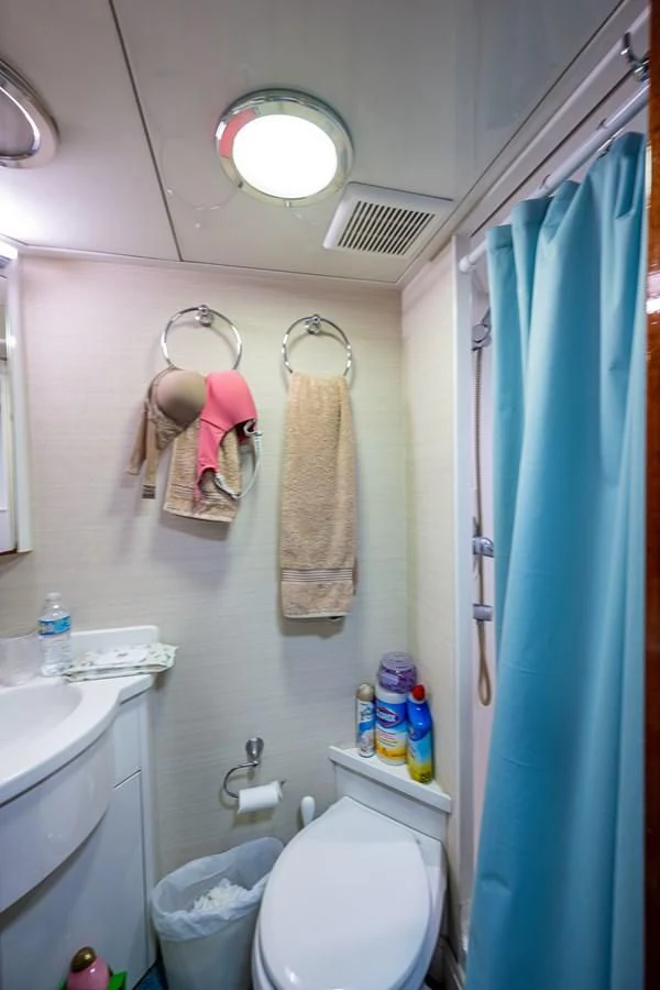 a bathroom with a toilet and a sink aboard KASHMIR Yacht for Charter